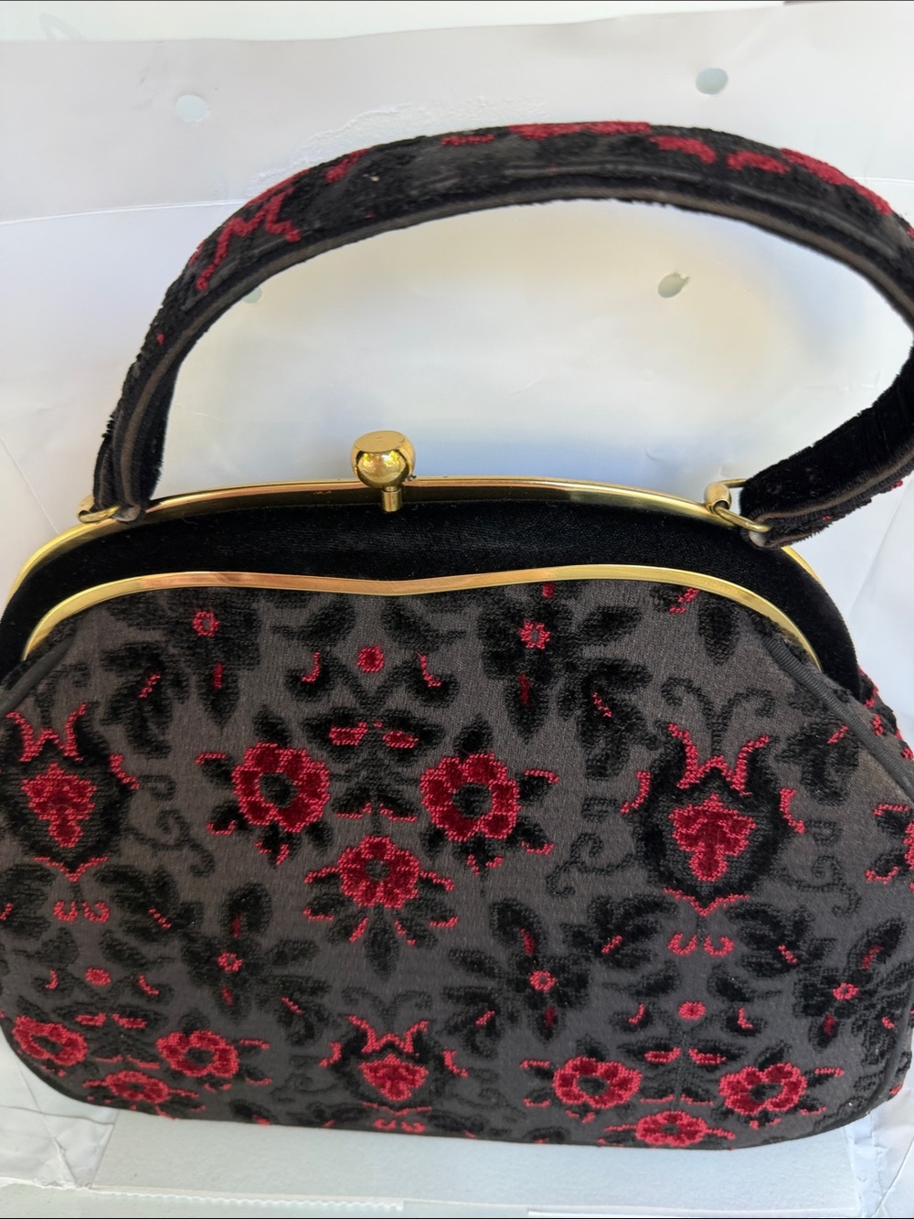 Black and Red Floral Frame Wristlet with Gold Accent